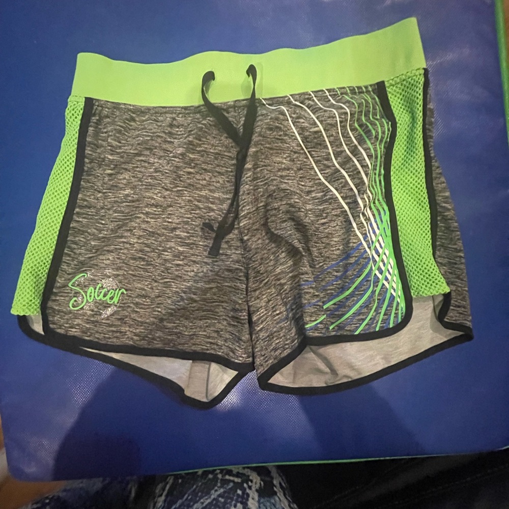 Justice Active soccer grey dolphin shorts with green mesh side detail size 18/20